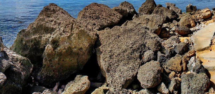 Coralline limestone boulders on the Sarangani Bay shore at Gumasa, Glan